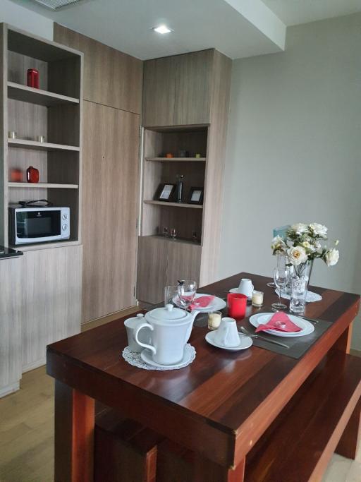 Modern kitchen interior with a wooden dining table set