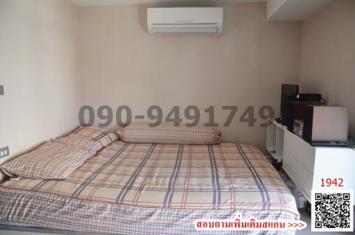 Spacious bedroom with air conditioning and ample natural light