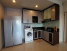 Modern kitchen with stainless steel appliances and wooden cabinets