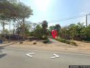 Vacant land ready for development along a roadside with trees