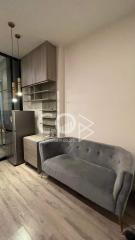 Modern living room with comfortable seating and stylish lighting