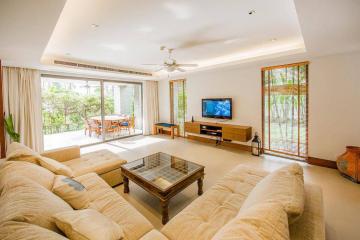 Spacious and well-lit living room with modern furniture and outdoor view