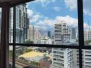 Scenic city skyline view from a high-rise building window