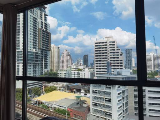 Scenic city skyline view from a high-rise building window