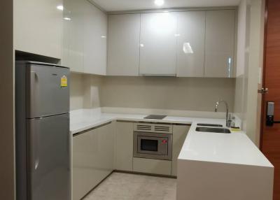 Modern kitchen with stainless steel appliances and white cabinetry