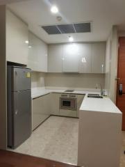 Modern kitchen with stainless steel appliances and white cabinetry