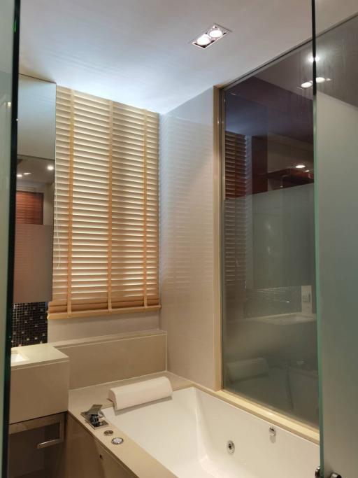 Contemporary bathroom with a tub and glass shower enclosure