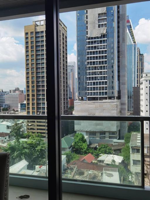 City skyline and neighborhood view from high-rise apartment window