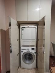 Stacked washing machine and dryer in a small laundry closet