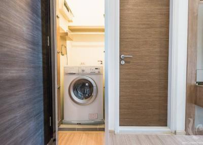 Compact laundry room with modern washer and dryer