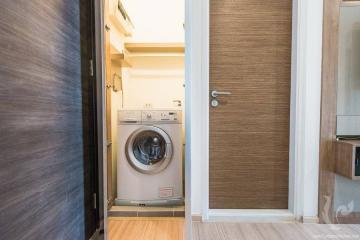 Compact laundry room with modern washer and dryer