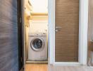 Compact laundry room with modern washer and dryer
