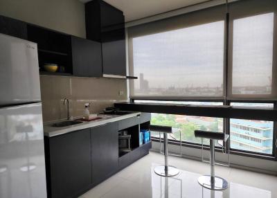 Modern kitchen with large windows and city view