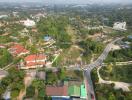 Aerial view of a residential area with clear proximity to main roads and abundant greenery