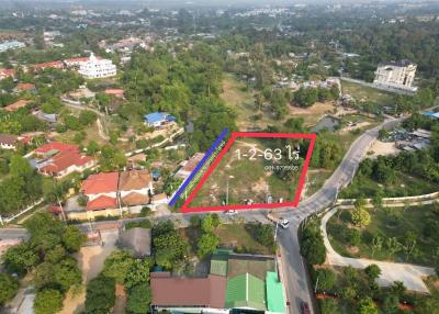 Aerial view of a property lot available for sale surrounded by residential neighborhood