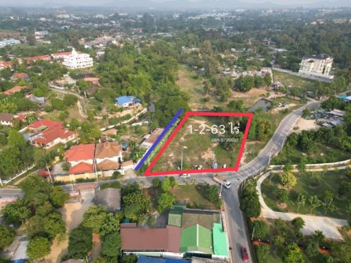 Aerial view of a property lot available for sale surrounded by residential neighborhood
