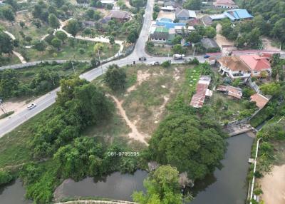 Aerial view of a vacant land plot with surroundings