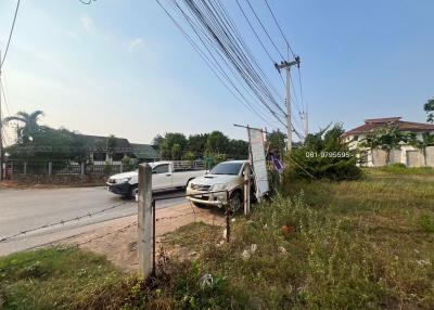 Street view with cars and residential area in the background