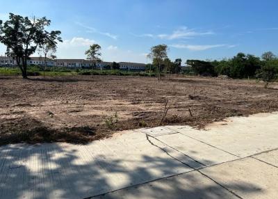 Empty residential land ready for construction with a clear sky