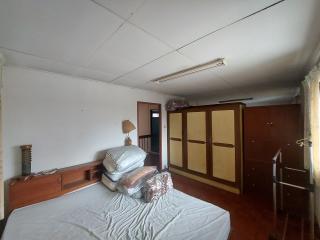 spacious bedroom with large wardrobe and ample natural light