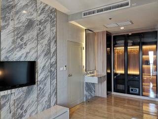 Modern living room with marble wall and wooden accents