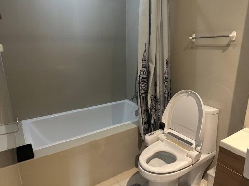 Modern bathroom with tub and artistic shower curtain