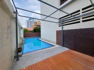 Private outdoor area with swimming pool and wooden decking