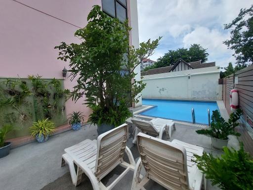 Peaceful backyard with swimming pool and seating area