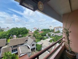 View from the balcony showcasing the neighborhood and green surroundings