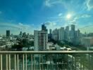 City view from high-rise balcony with clear skies