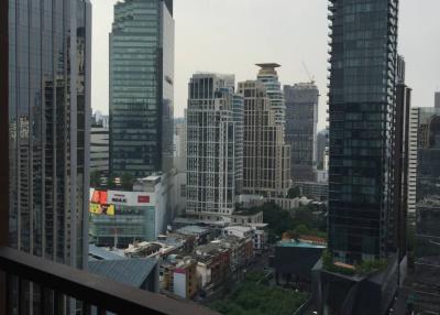 View from balcony overlooking the cityscape with skyscrapers