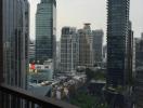 View from balcony overlooking the cityscape with skyscrapers