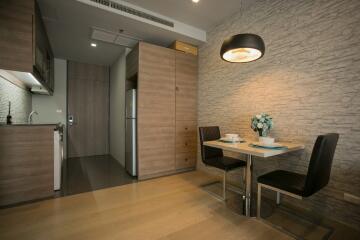 Modern dining area with adjoining kitchen space