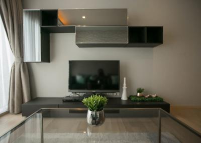 Modern living room interior with mounted television and shelving