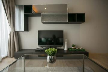 Modern living room interior with mounted television and shelving