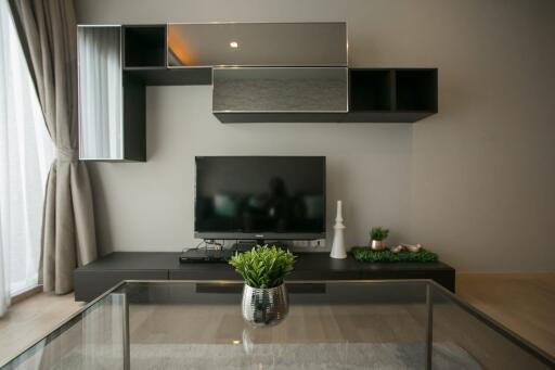 Modern living room interior with mounted television and shelving