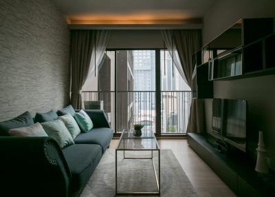 Modern living room with comfortable seating and natural light