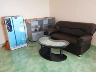 Compact living room with leather sofa and glass coffee table