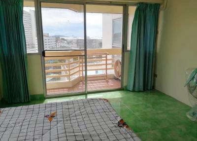 Bright bedroom with a balcony view in an apartment