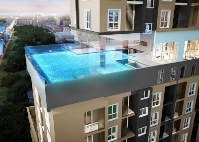 Modern apartment complex with rooftop pool at dusk