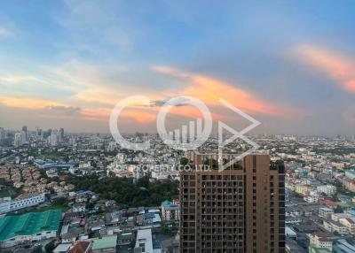 High-rise building overlooking a cityscape during sunset