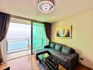 Bright and modern living room with ocean view and balcony access