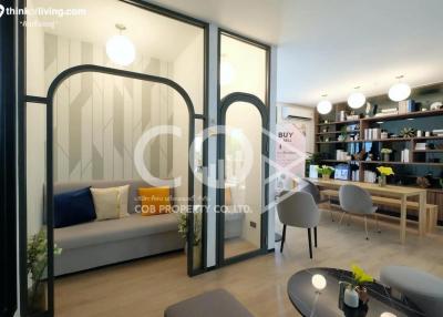 Modern living room with elegant furniture and open shelving