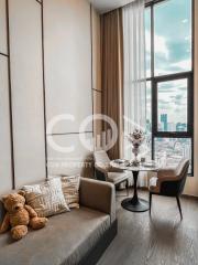 Modern living room with large window and city view