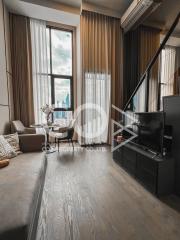 Modern living room with city view and staircase