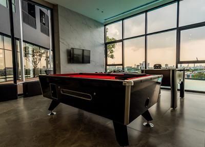 Spacious recreation room with pool table and modern design