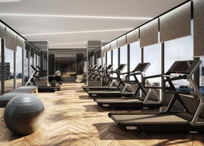 Modern gym interior with multiple treadmills and panoramic city views