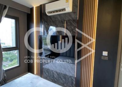 Modern bedroom interior with marble wall and mounted air conditioning unit