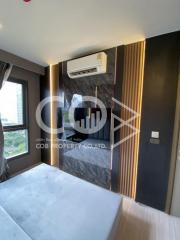 Modern bedroom interior with marble wall and mounted air conditioning unit