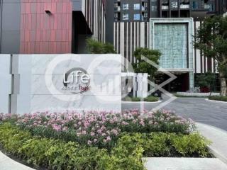 Luxurious Residential Building Entrance with Landscaped Garden